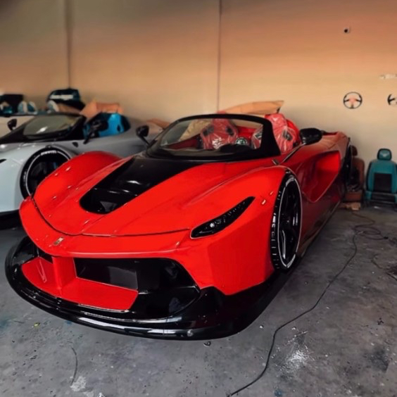 Red jetcar in the atelier workshop during hand finishing
