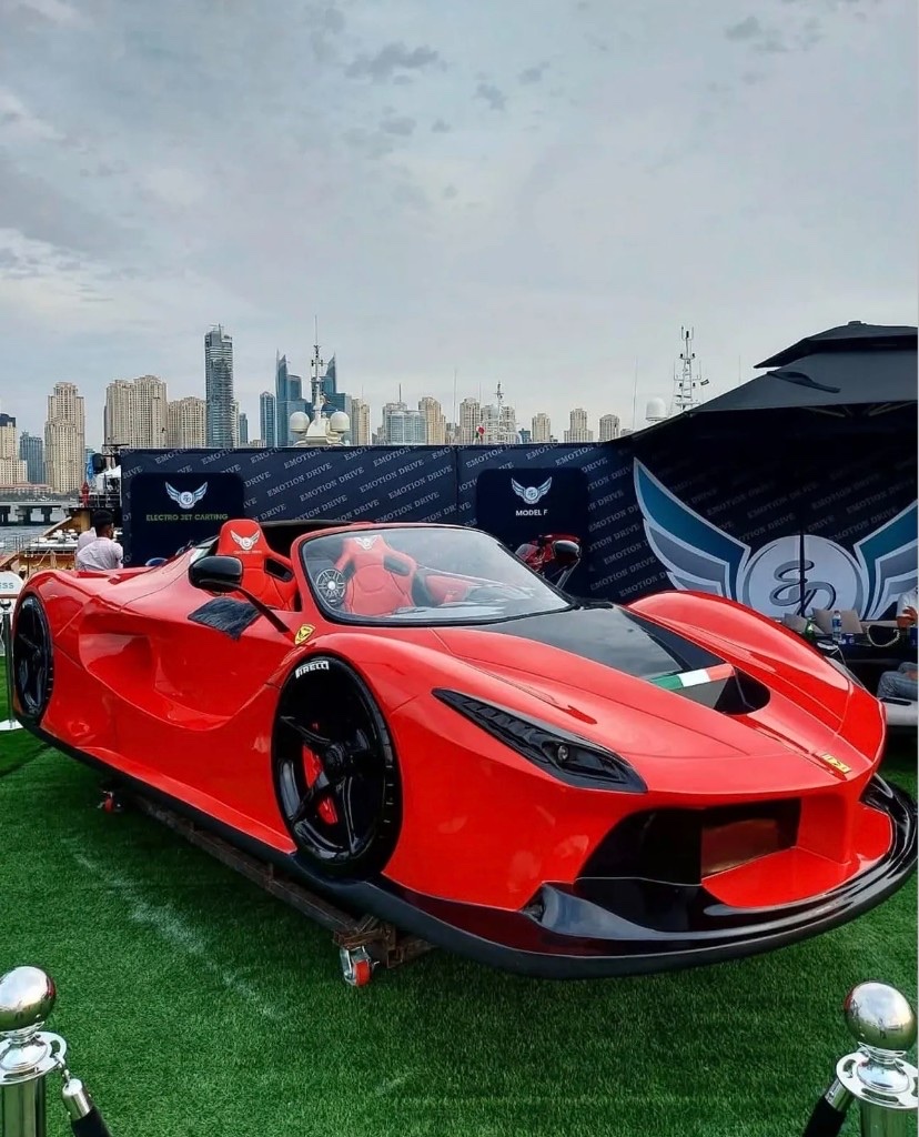 Red Electro Jet Kart on display with Rotterdam skyline backdrop